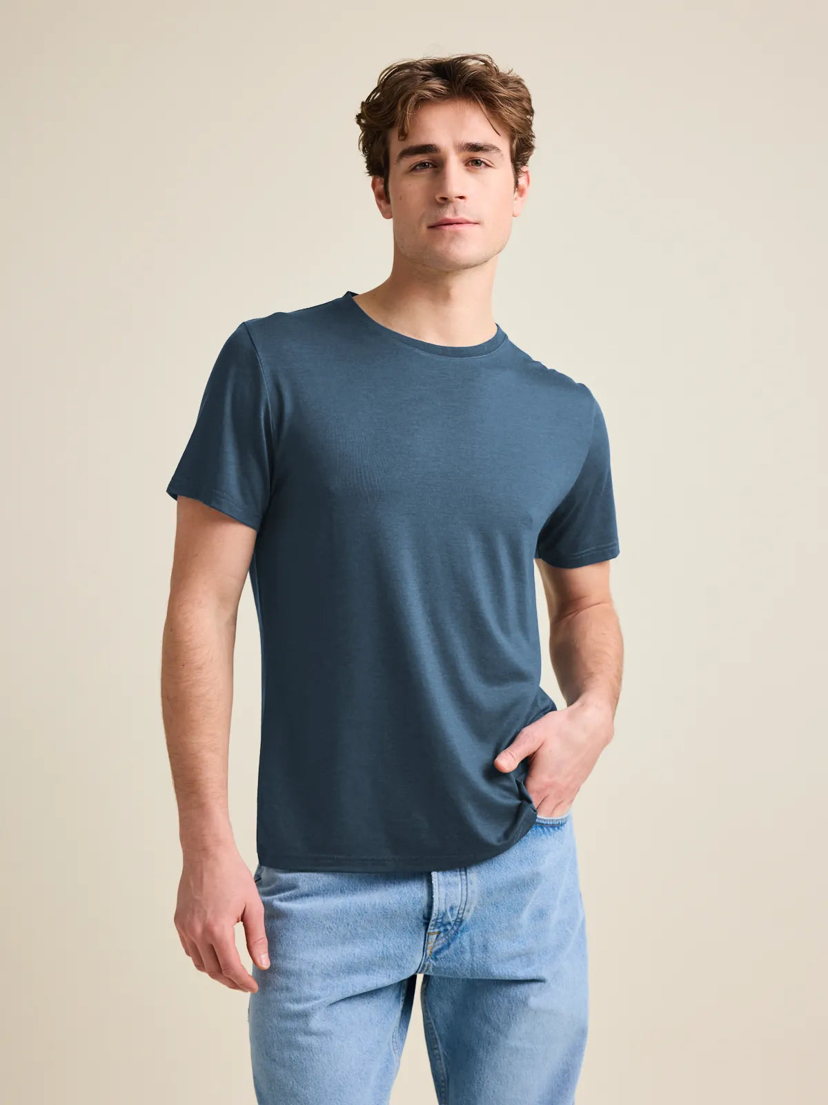 Studio shot of a men's merino wool T-shirt in denim blue, designed by Wolk.