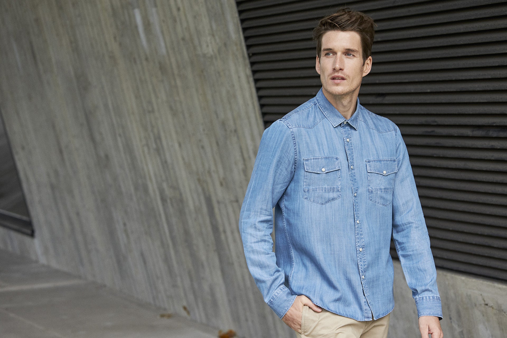 men wearing tencel denim shirt with chest pockets and long sleeves
