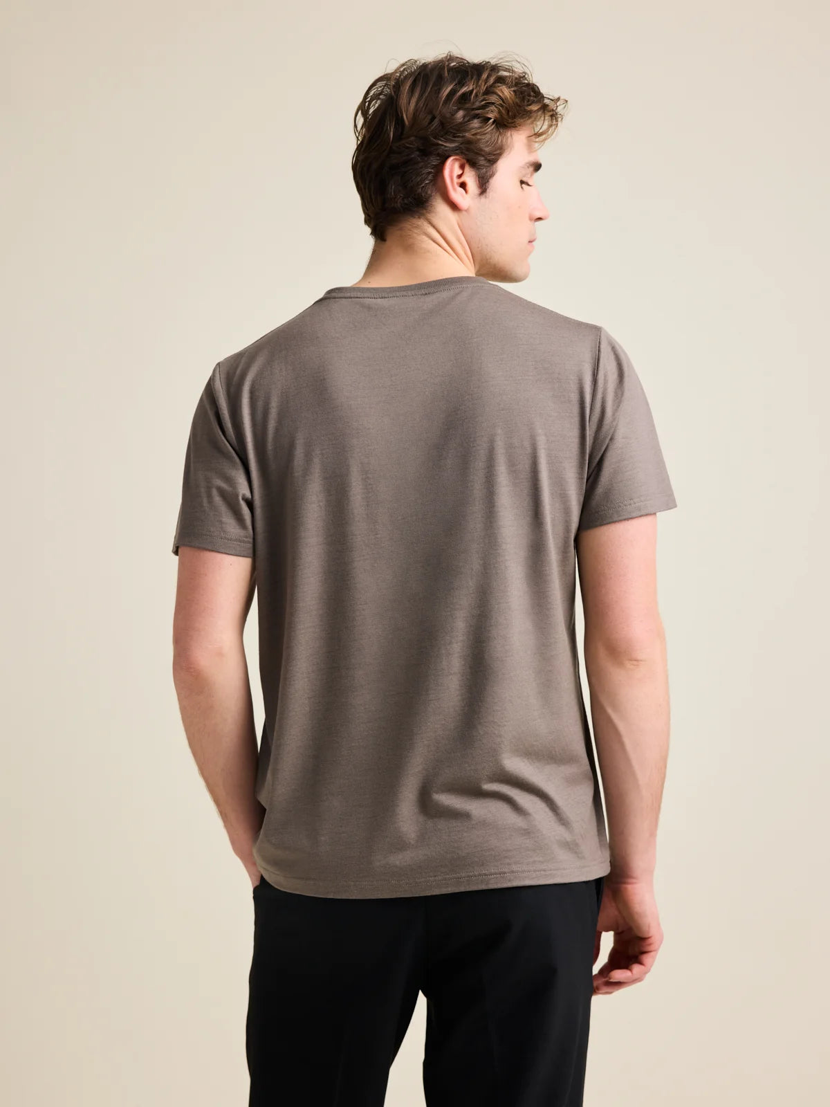 Men's chocolate brown merino wool T-shirt from Wolk, back profile, highlighting smooth fit and finish.