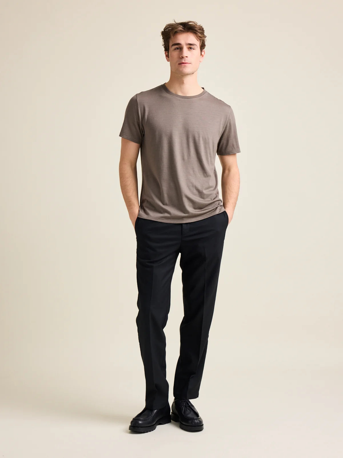 Wolk's chocolate brown men's merino wool T-shirt in a studio setting, showcasing crew-neck design.