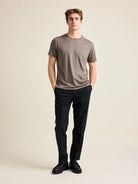 Wolk's chocolate brown men's merino wool T-shirt in a studio setting, showcasing crew-neck design.