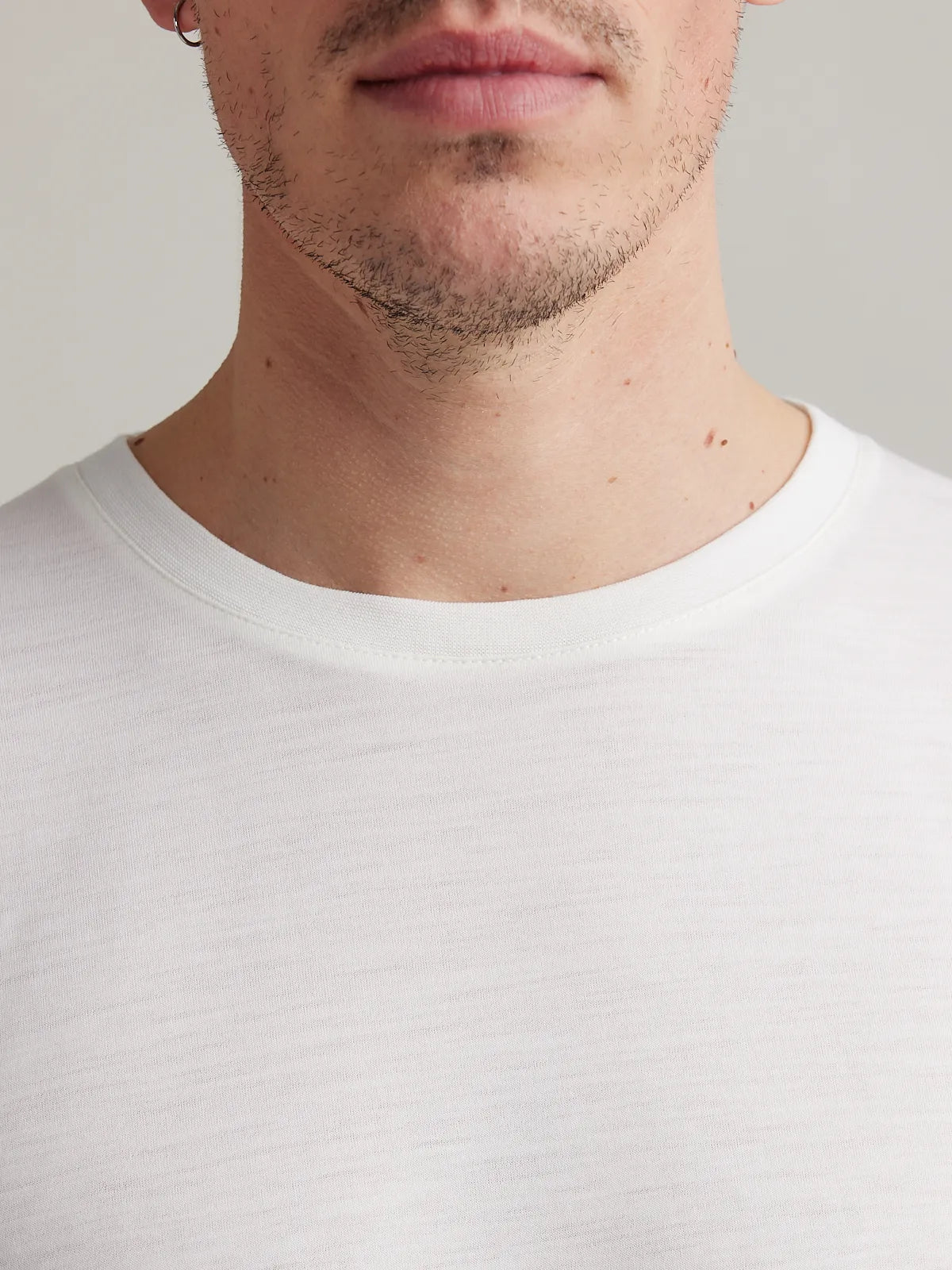 Men's merino wool T-shirt from Wolk in white, displaying the crew neck.