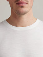 Men's merino wool T-shirt from Wolk in white, displaying the crew neck.