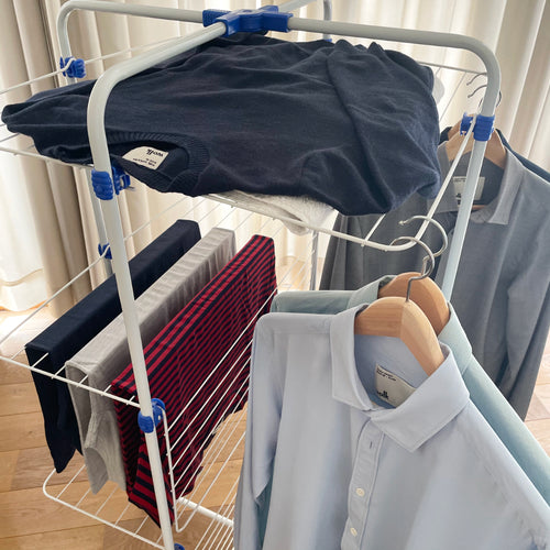 drying merino wool shirt, t-shirt and sweater on a drying rack