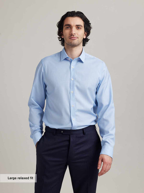 Man wears a merino wool shirt from Wolk antwerp in relaxed fit