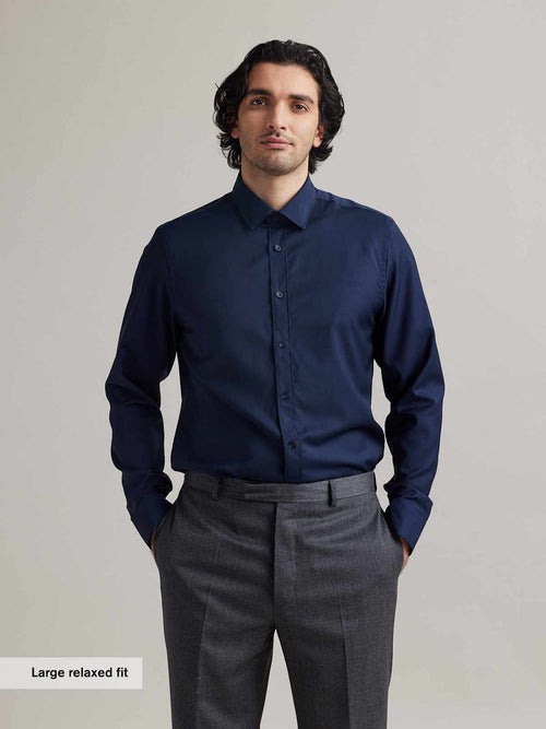 man wearing merino wol relaxed fit shirt in navy blue color with long sleeves from Wolk