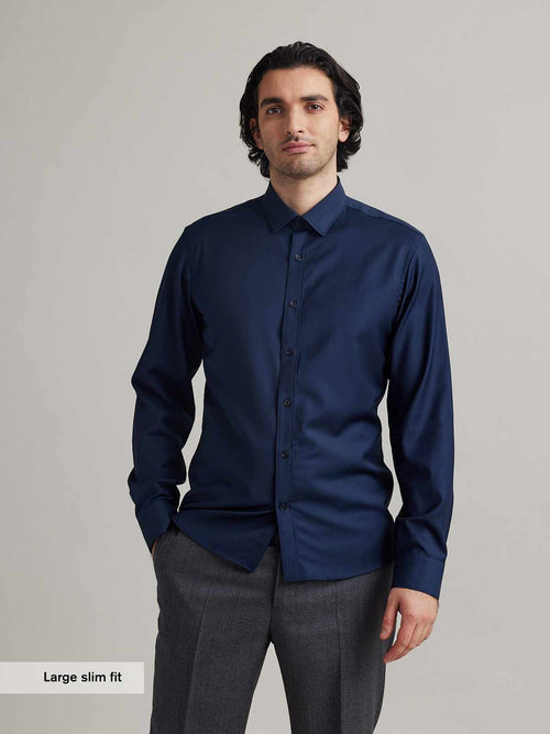 Wolk man wearing merino wol shirt in navy blue color with long sleeves from Wolk in 100% merino wool