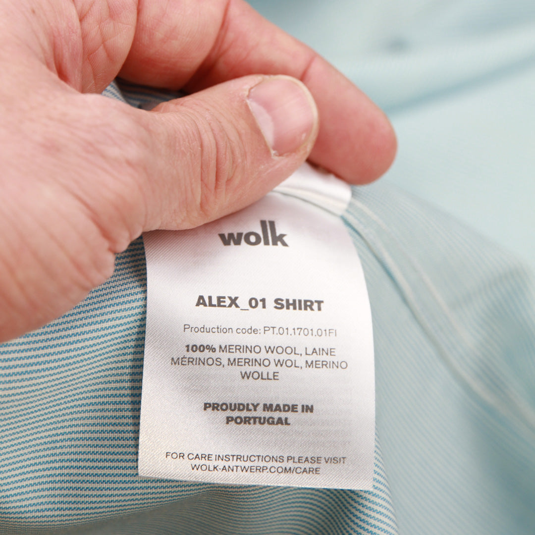 Close up of clothing label of the Alex merino wool shirt from Wolk made in Portugal with 100 % merino wool