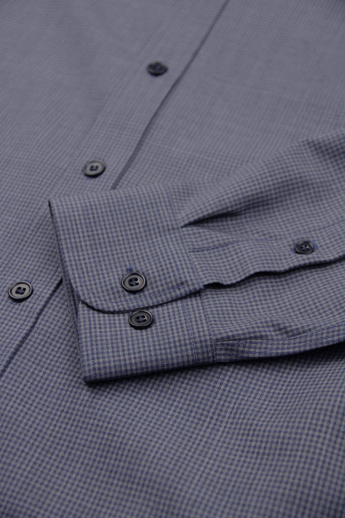 cuff detail of merino wool shirt in grey navy mini gingham and corozo buttons