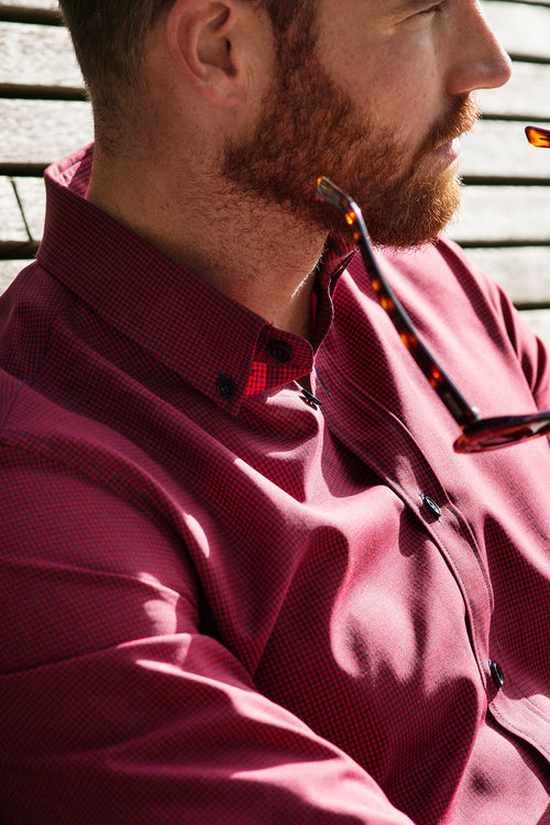 Wolk - man wearing a merino shirt with button down collar in red navy mini gingham