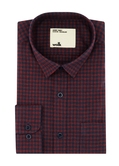 Merino flanel shirt for men folded with normal collar and corozo buttons in blue red gingham