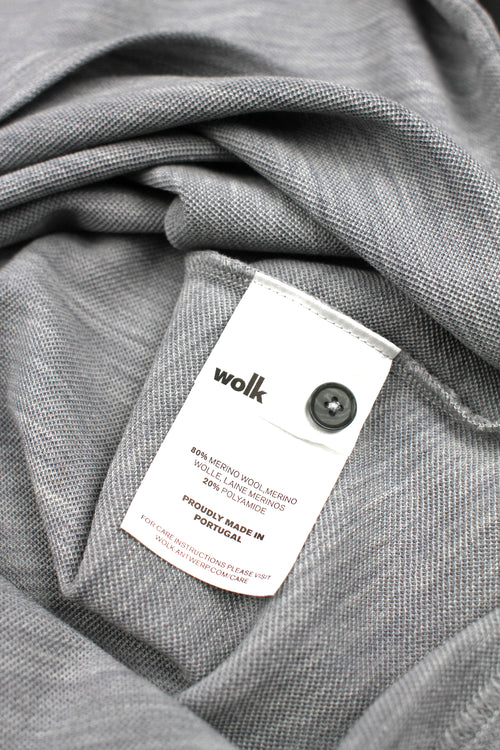Wolk label of merino wool polo in grey melange color made in portugal 
