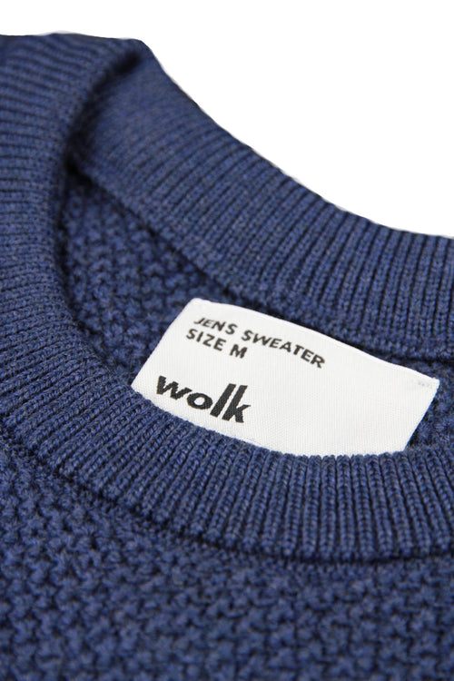 label of Wolk antwerp merino wool sweater
