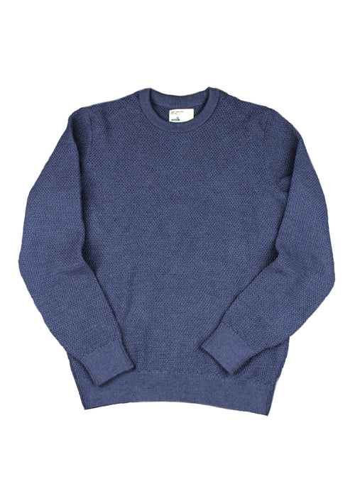 flat lay of merino wool sweater of wolk antwerp made of superfine merino wool in navy color produced in Portugal