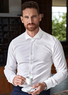 Man wears 100% white merino shirt with long sleeves and spread color 