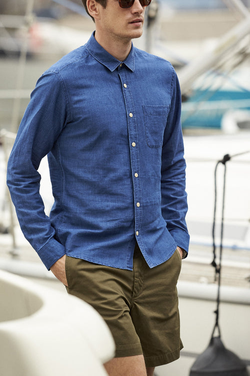 Man wearing blue indigo dyed linen shirt with chest pocket