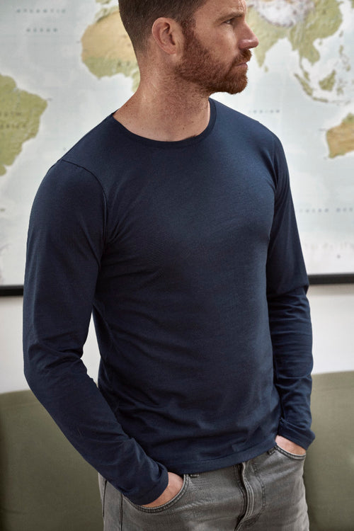 man wearing long sleeve T-shirt from merino wool in navy blue color